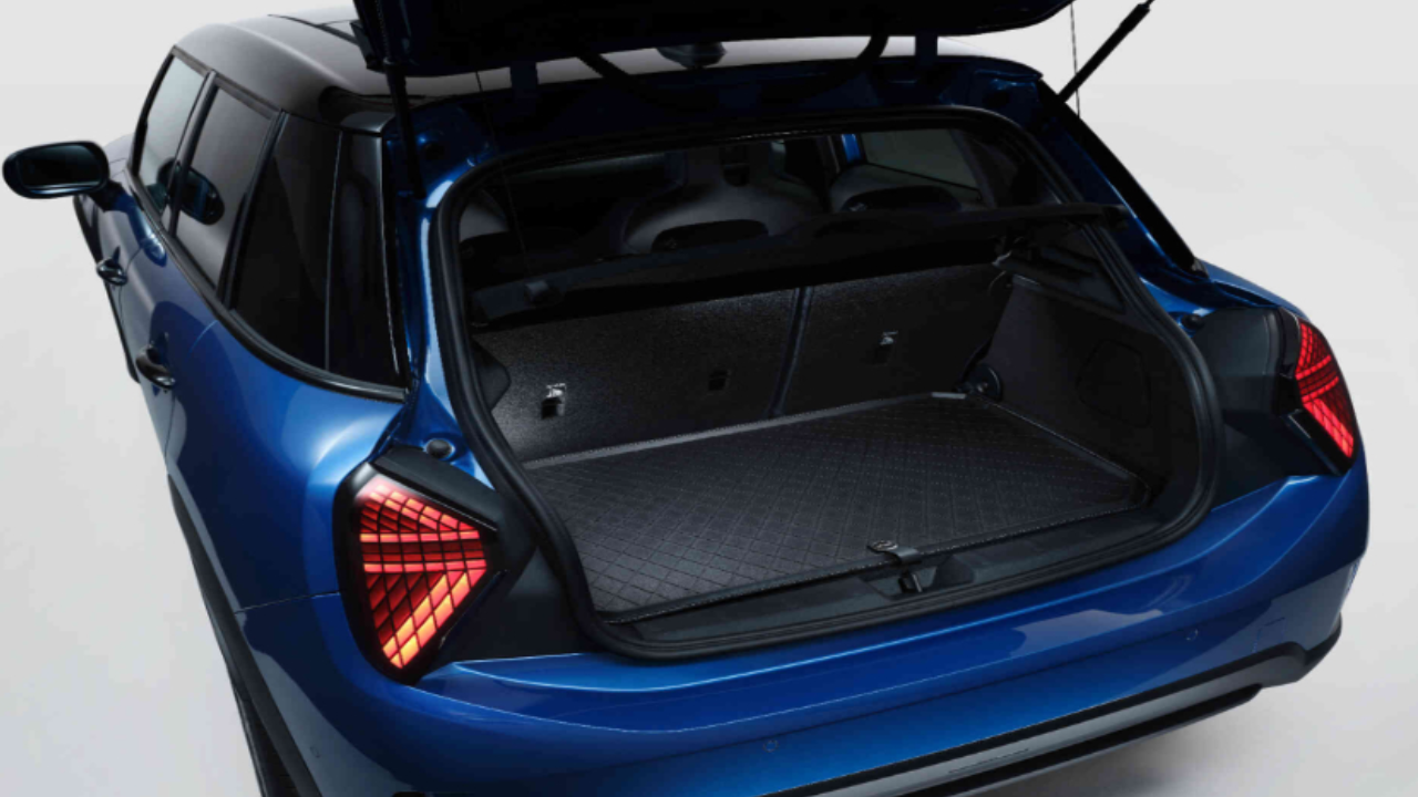 The open trunk of a blue MINI showing ample storage space
