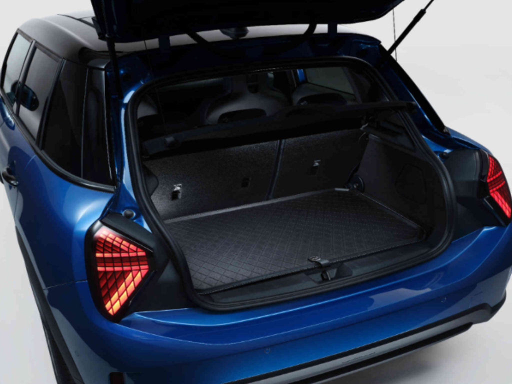 The open trunk of a blue MINI showing ample storage space
